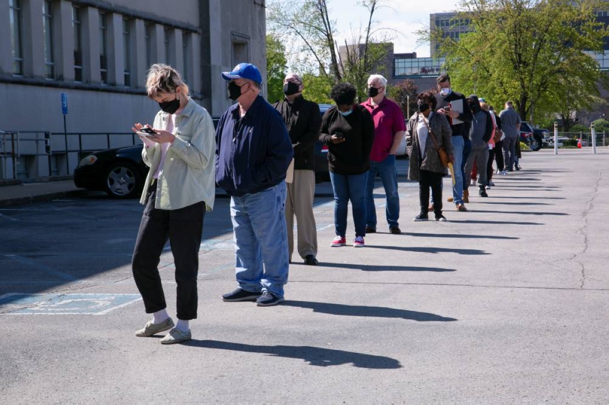 People line up outside a newly-reopened career centre for in-person appointments in Louisville. US private payrolls rebounded less than expected in December, the ADP's national employment ‌report showed Wednesday.