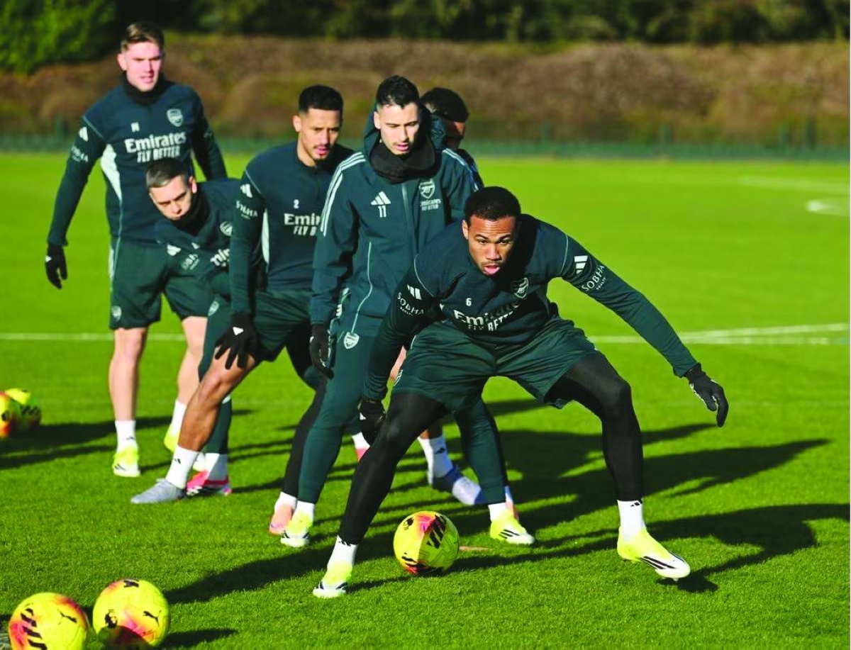 
Qatar’s Marwan Sherif (right) and UAE’s Hazem Abbas vie for the ball in Jeddah. Arsenal defender Gabriel Magalhaes trains with team-mates ahead of the game against Liverpool. 