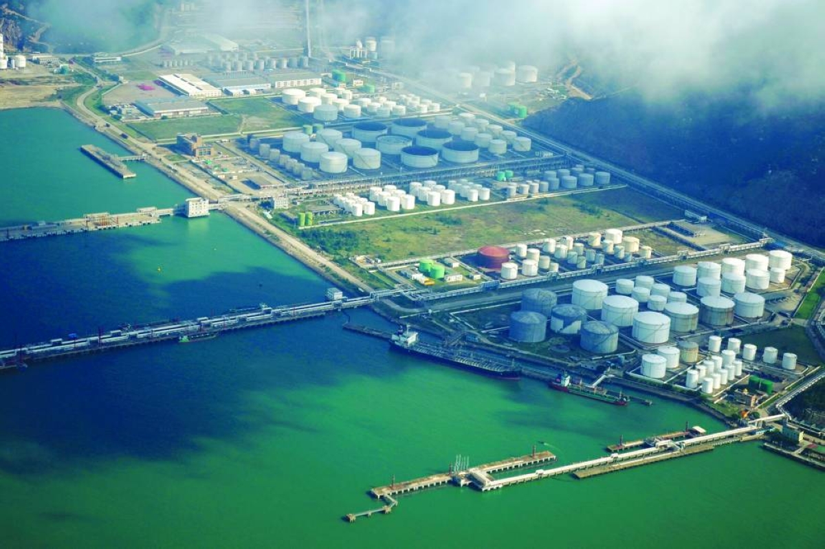 Oil and gas tanks are seen at an oil warehouse at a port in Zhuhai. China imported 389,000 barrels per day of Venezuelan oil in 2025, about 4% of its total seaborne crude imports, Kpler data showed.