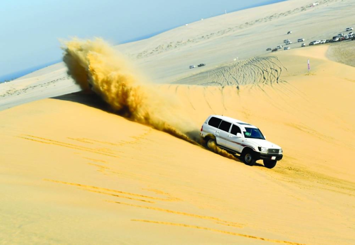 Drifting across sand dunes in SUVs is a passion for many youth.