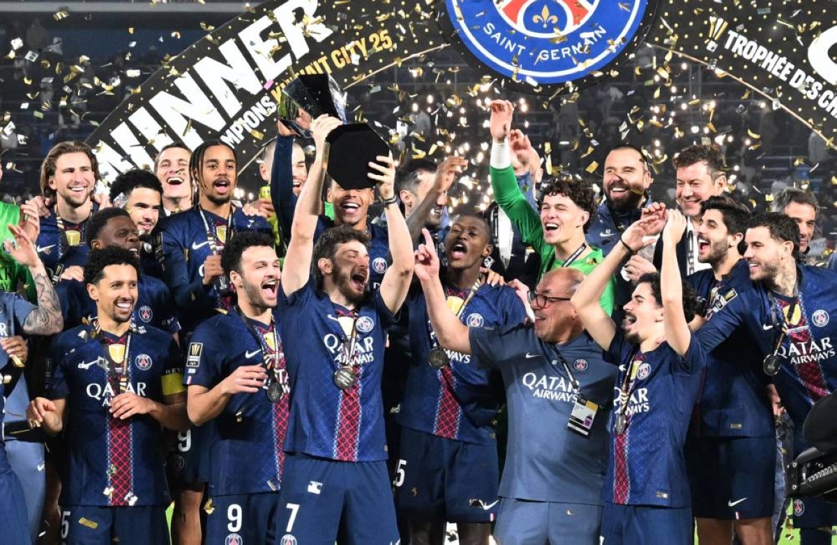 PSG's players celebrate with the trophy after winning the French Champions' Trophy (Trophee des Champions) football match between Paris Saint-Germain (PSG) and Olympique de Marseille (OM) at the Jaber Al-Ahmad International Stadium in Kuwait City on January 8, 2026. (AFP)