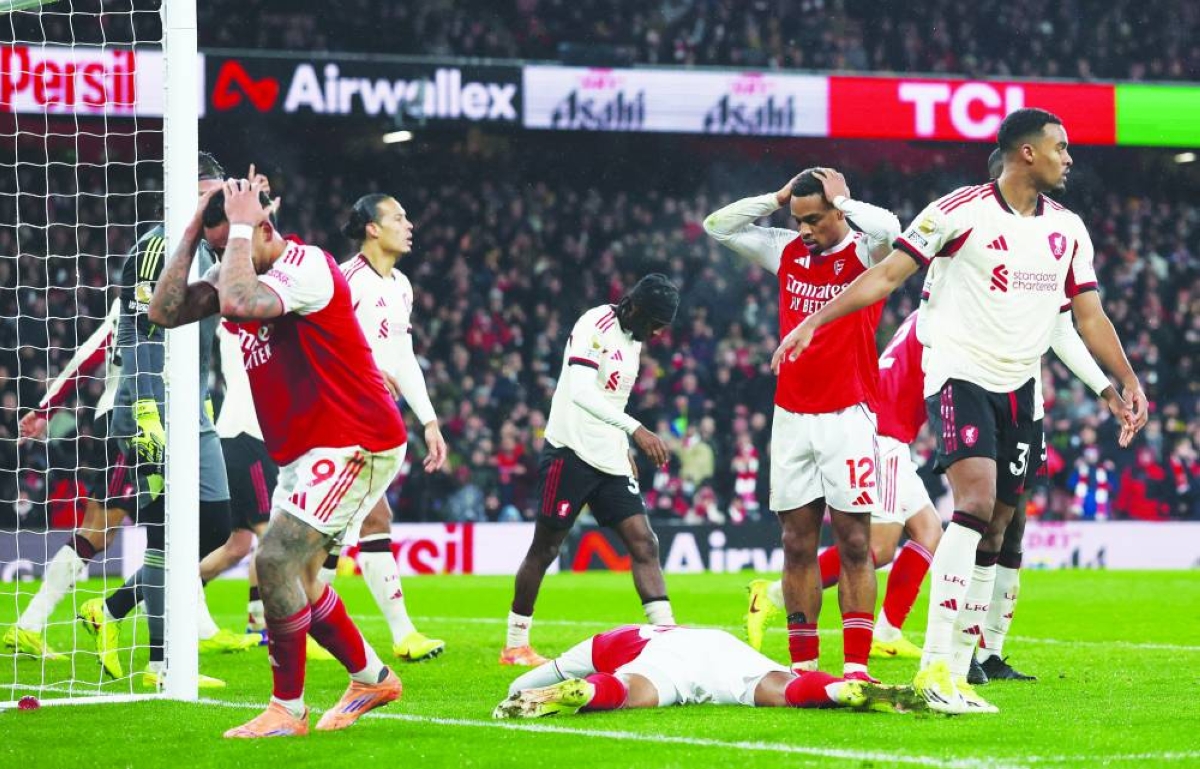 Soccer Football - Premier League - Arsenal v Liverpool - Emirates Stadium, London, Britain - January 8, 2026
Arsenal's Gabriel Jesus and Jurrien Timber react as Gabriel Magalhaes misses a chance to score Action Images via Reuters/Paul Childs EDITORIAL USE ONLY. NO USE WITH UNAUTHORIZED AUDIO, VIDEO, DATA, FIXTURE LISTS, CLUB/LEAGUE LOGOS OR 'LIVE' SERVICES. ONLINE IN-MATCH USE LIMITED TO 120 IMAGES, NO VIDEO EMULATION. NO USE IN BETTING, GAMES OR SINGLE CLUB/LEAGUE/PLAYER PUBLICATIONS. PLEASE CONTACT YOUR ACCOUNT REPRESENTATIVE FOR FURTHER DETAILS..