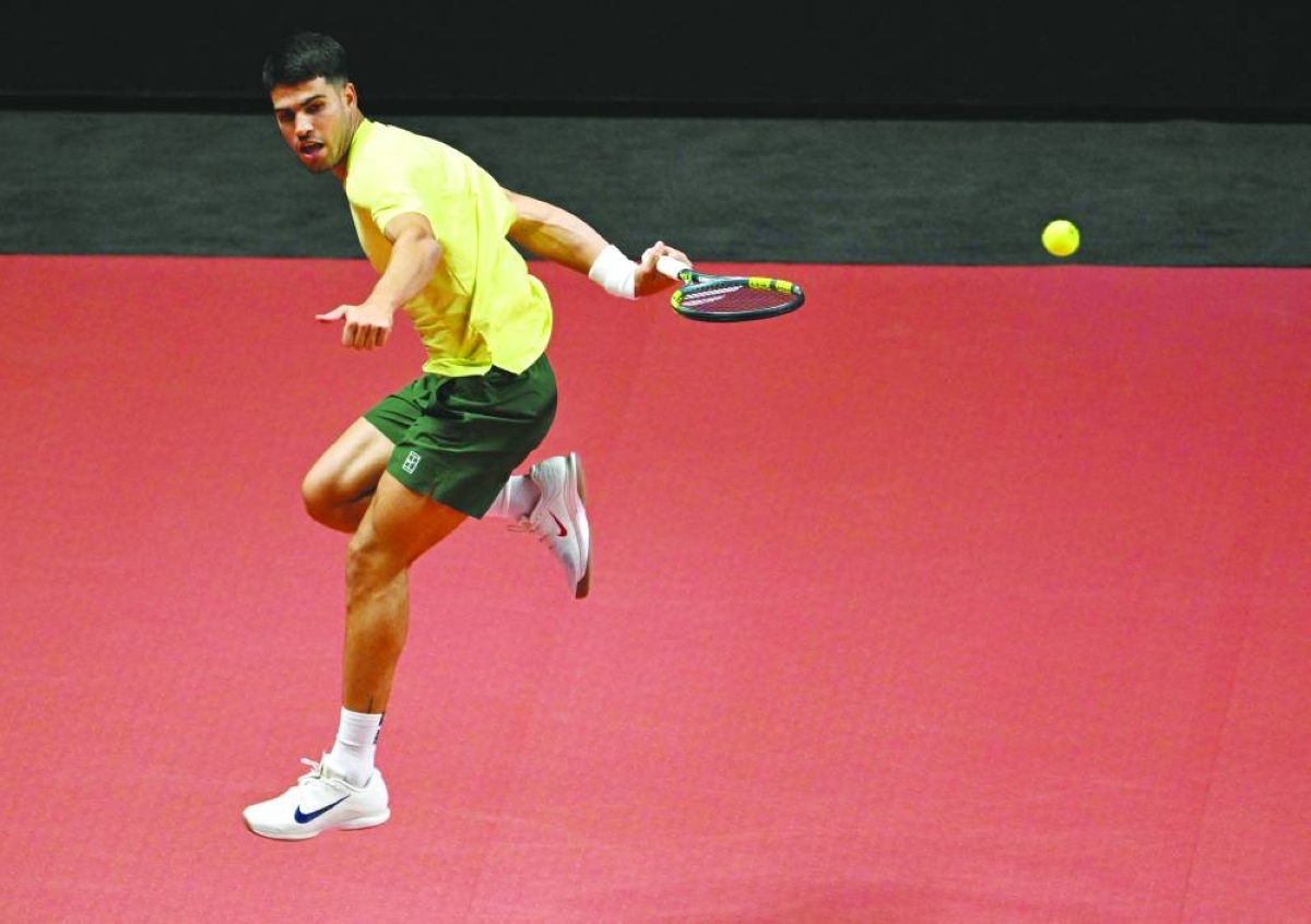 Spain's Carlos Alcaraz hits a return to Italy's Jannik Sinner during their exhibition tennis match at Inspire Arena in Incheon on January 10, 2026. (AFP)