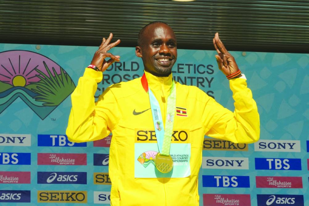 Jan 10, 2026; Tallahassee, FL, USA; Jacob Kiplimo (UGA) poses with gold medal after winning the men's senior race in 28:18 during the World Athletics Cross Country Championships Tallahassee 26 at Apalachee Regional Park.