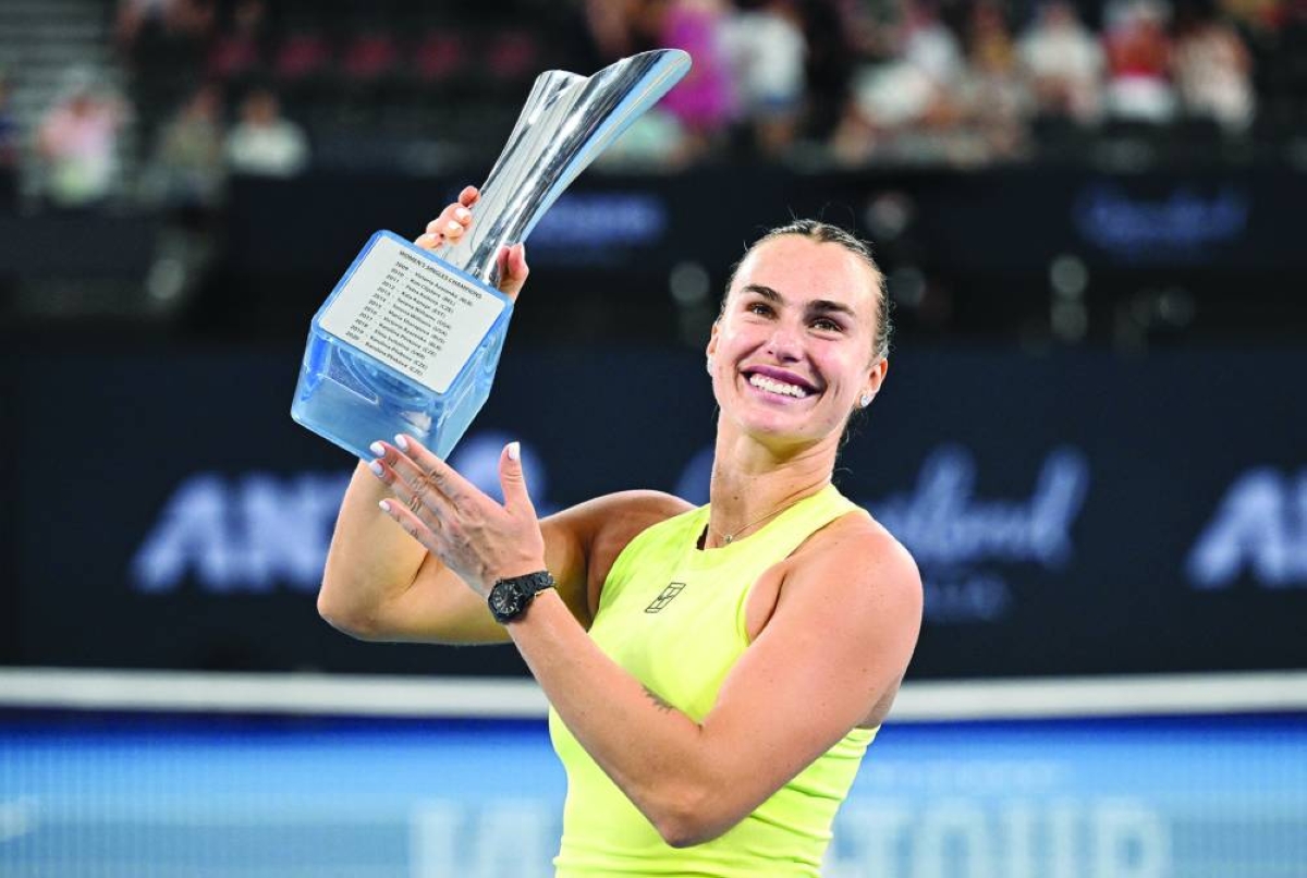 Belarus' Aryna Sabalenka celebrates with the trophy after winning the Brisbane International Sunday. (Reuters)