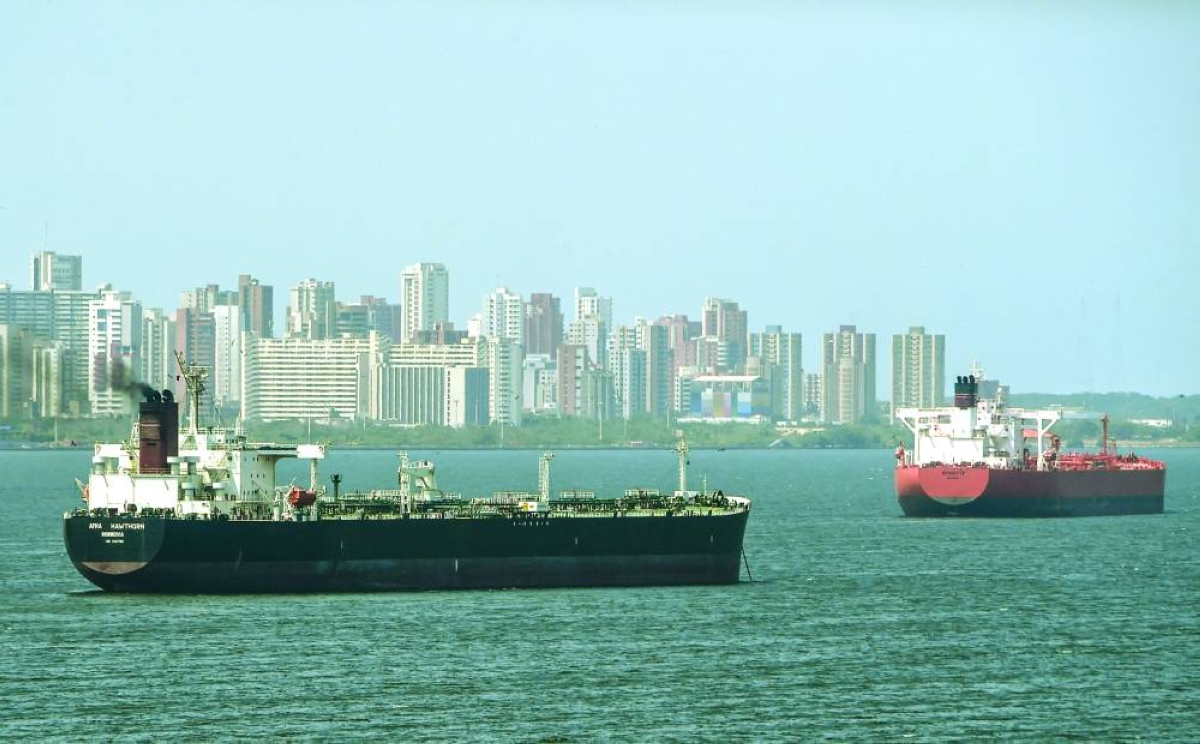 Oil tankers sail the Maracaibo Lake in Maracaibo, Venezuela. The US ⁠government tapped the giant merchant houses because they were better suited to quickly ⁠get Venezuelan oil exports flowing again, four industry sources familiar with the negotiations said. 