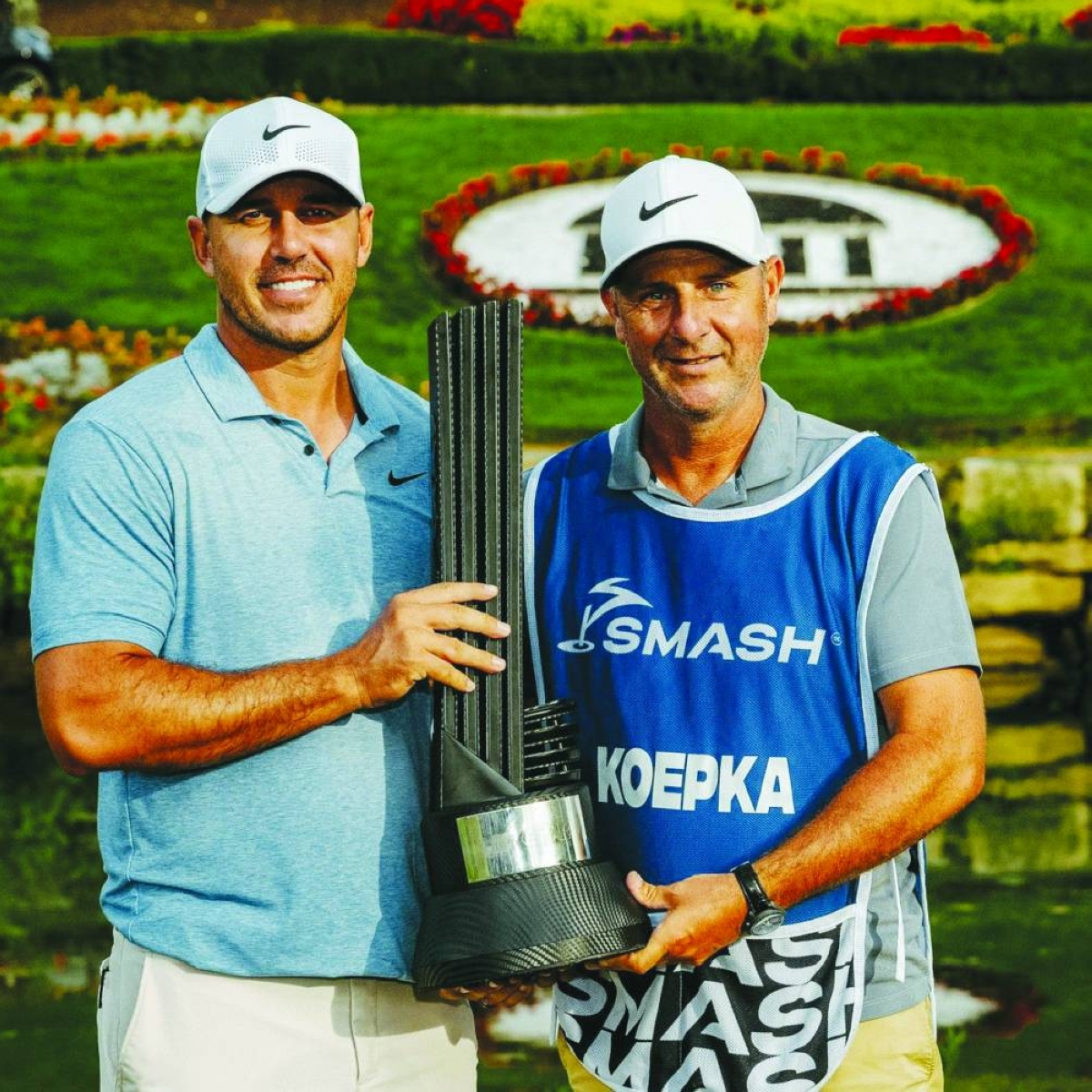 
Brooks Koepka (left) celebrates an LIV Golf win with his caddie in 2024. A five-time major champion, Koepka has quit the LIV circuit. 