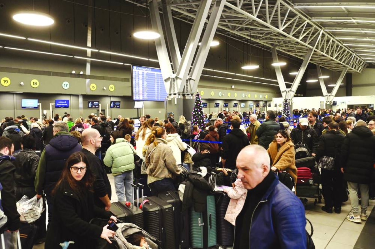 Passengers wait at the Thessaloniki Airport "Makedonia" amidst disruption in flights across Greece linked to a technical problem at the Athens Flight Information Region, in Thessaloniki, on January 4. A systems failure which forced Greece to close its airspace for several hours with pilots unable to speak to air traffic control, has exposed badly outdated communication systems at Athens International Airport -- one of the world's top travel destinations. 