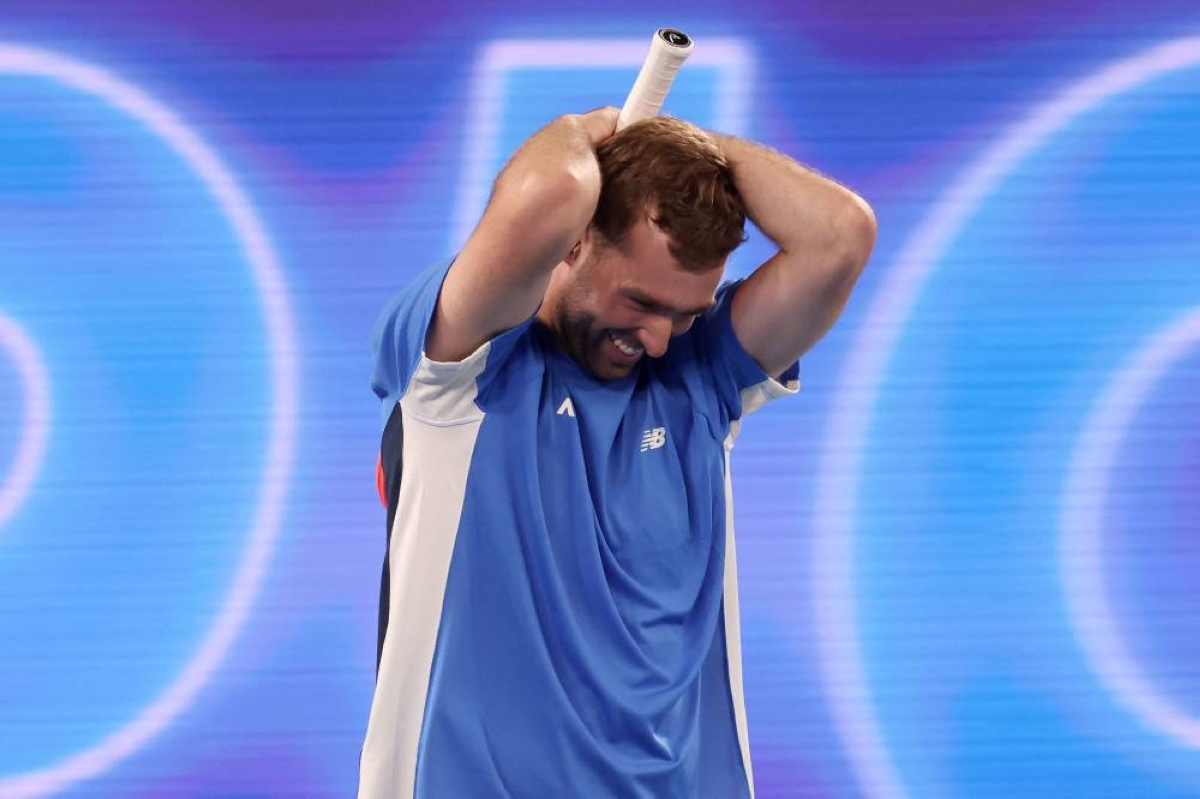 Australia’s Jordan Smith celebrates after defeating Taiwan's Joanna Garland in the 1 Point Slam exhibition event ahead of the 2026 Australian Open at Rod Laver Arena in Melbourne on January 14, 2026. (AFP) 