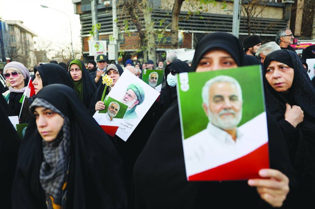 People attend the funeral of the security forces who were killed in the protests that erupted over the collapse of the currency's value in Tehran, Iran, Wednesday.