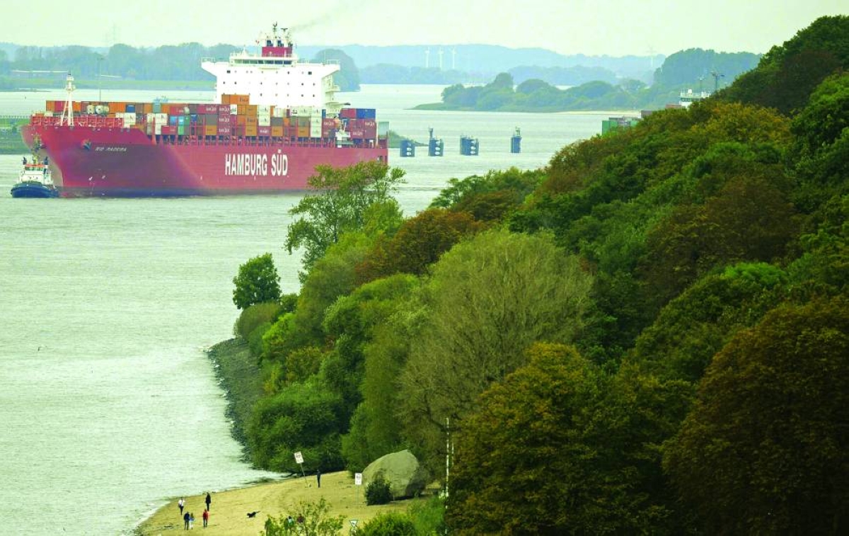 A containership sails on the Elbe river as it arrives at the harbour of Hamburg. Germany's economy eked out meagre growth in 2025 and dodged a third straight year of recession, data showed on Thursday, but Europe's languishing industrial powerhouse still faces huge challenges to return to long-term health.