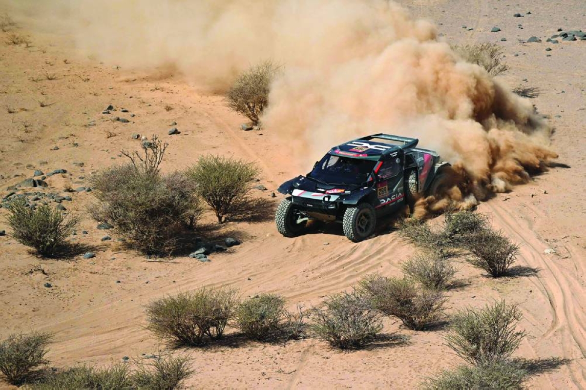 The Dacia Sandriders’s Qatari driver Nasser Al?Attiyah and Belgian copilot Fabian Lurquin compete in Stage 11 of the 48th edition of the Dakar Rally 2026, between Bisha and al-Henakiyah, Saudi Arabia, on January 15, 2026. (AFP)