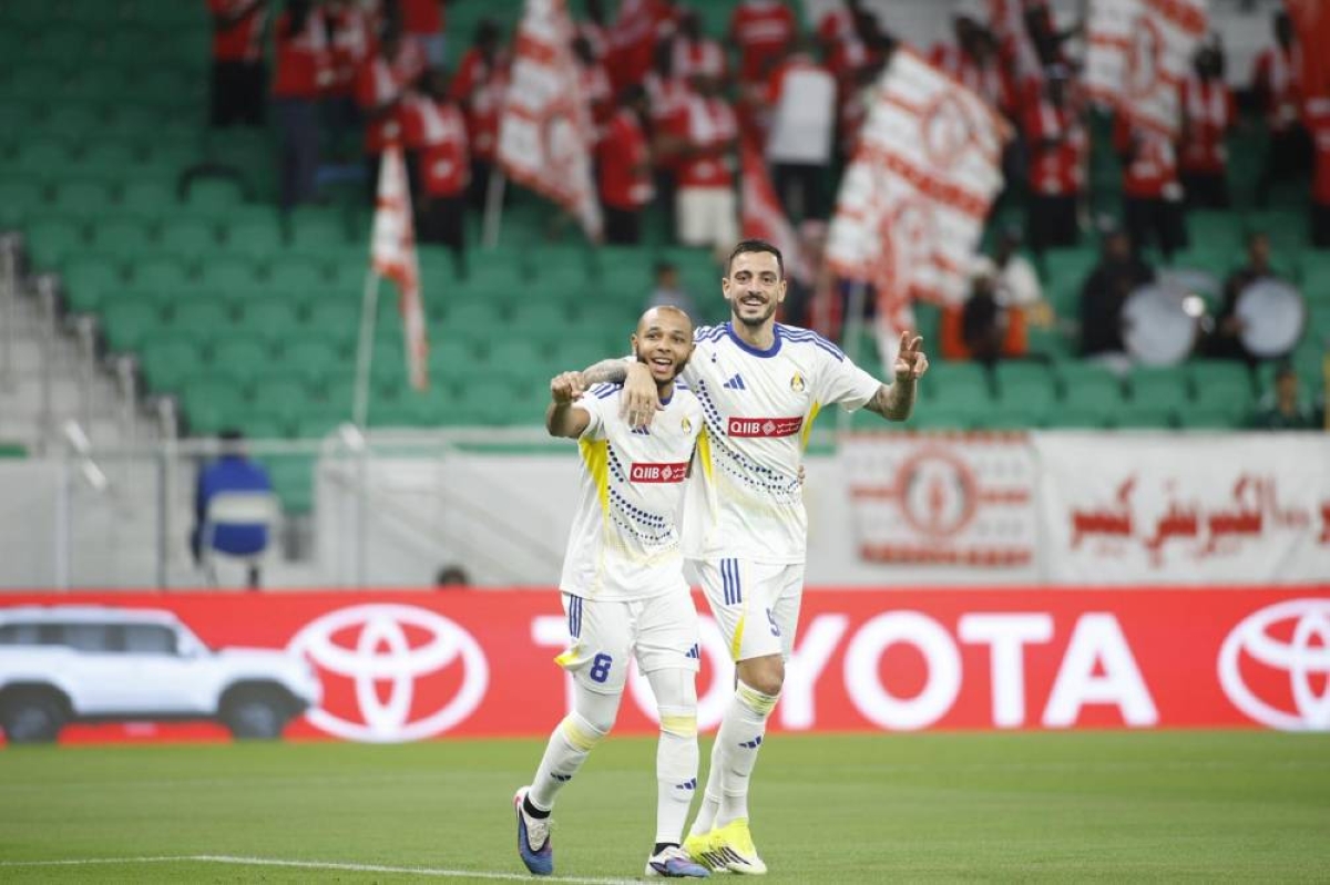 Al Gharafa's Joselu (right) celebrates with Yacine Brahimi after scoring against Al Arabi at the Al Thumama Stadium. 