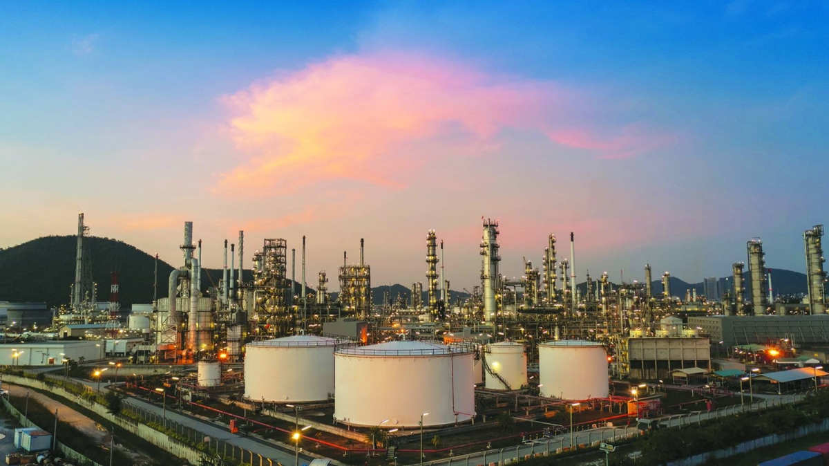 Chemical oil refinery plant, power plant and metal pipe concept industry. Oil prices settled higher on Friday as some investors covered short positions ahead of the three-day Martin Luther King holiday weekend in the US and lingering worries about a possible US military strike against Iran.