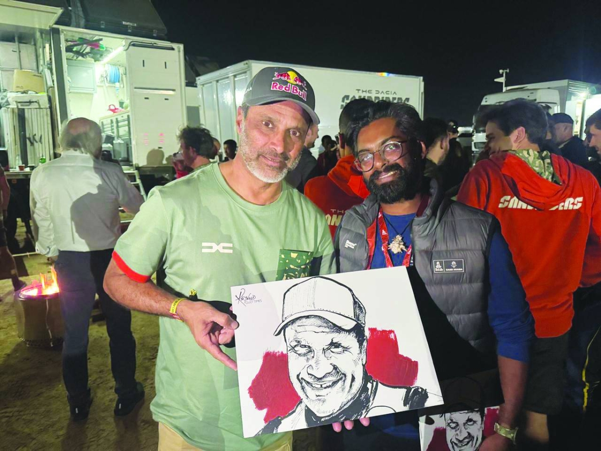 Nasser al-Attiyah posing with his sketch made by Gulf Times cartoonist Reynold Philips. It was presented to the six-time Dakar Rally champion by Event Manager Dakar Rally, Anoop Reynold, in Yanbu, Saudi Arabia.