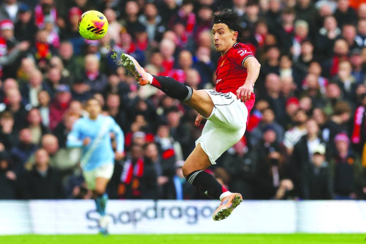 Manchester United's Lisandro Martinez controls the ball during the Premier League match against Manchester City at Old Trafford in Manchester on Saturday. (AFP) 