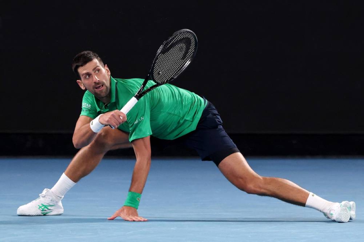 Serbia's Novak Djokovic hits a return to Spain’s Pedro Martinez during their Australian Open match in Melbourne yesterday. (AFP) 