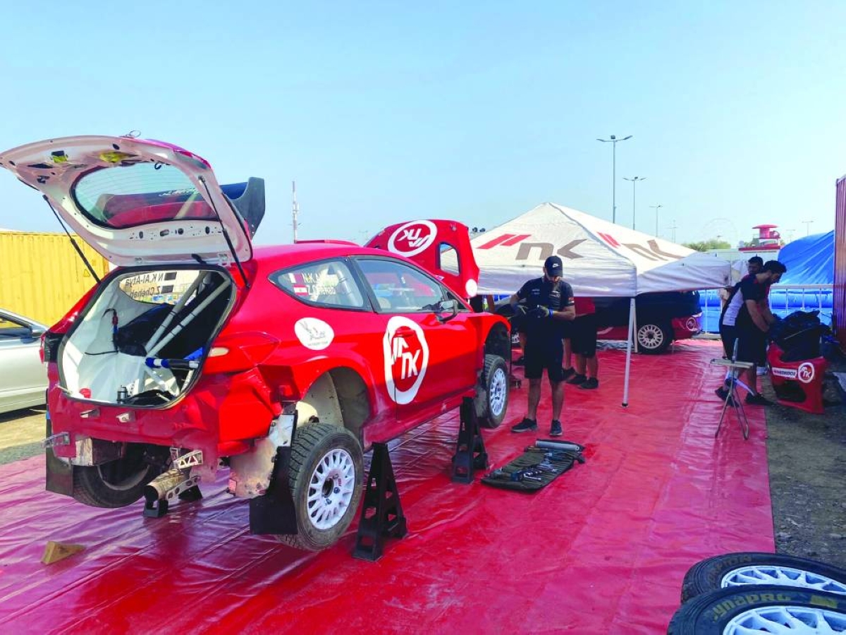 Team technicians work on Nasser Khalifa al-Atya's Ford.
