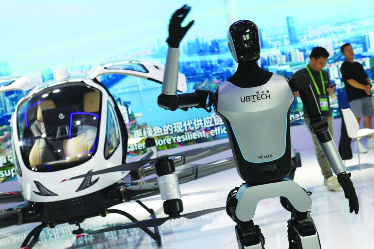 A UBTech humanoid robot waves its hand during the China International Supply Chain Expo in Beijing. UBTech said Wednesday it had signed a ‌deal with the world's ‌largest planemaker, Airbus, ‍to supply robots for use in aviation ⁠manufacturing.