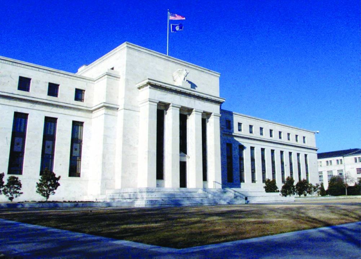 The US Federal Reserve building in Washington, DC. The Fed will hold its key interest rate through this quarter and possibly until chair Jerome Powell's tenure ends in May, according to a majority of economists polled by Reuters, a shift from ‌last month when most expected at least one cut by March.