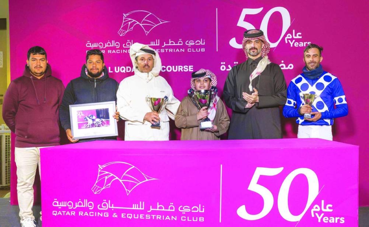 Connections of Naseeb Zakhir celebrate after the five-year-old grey horse won the Mesaieed Cup at Al Uqda Racecourse Wednesday.              PICTURES: Juhaim
