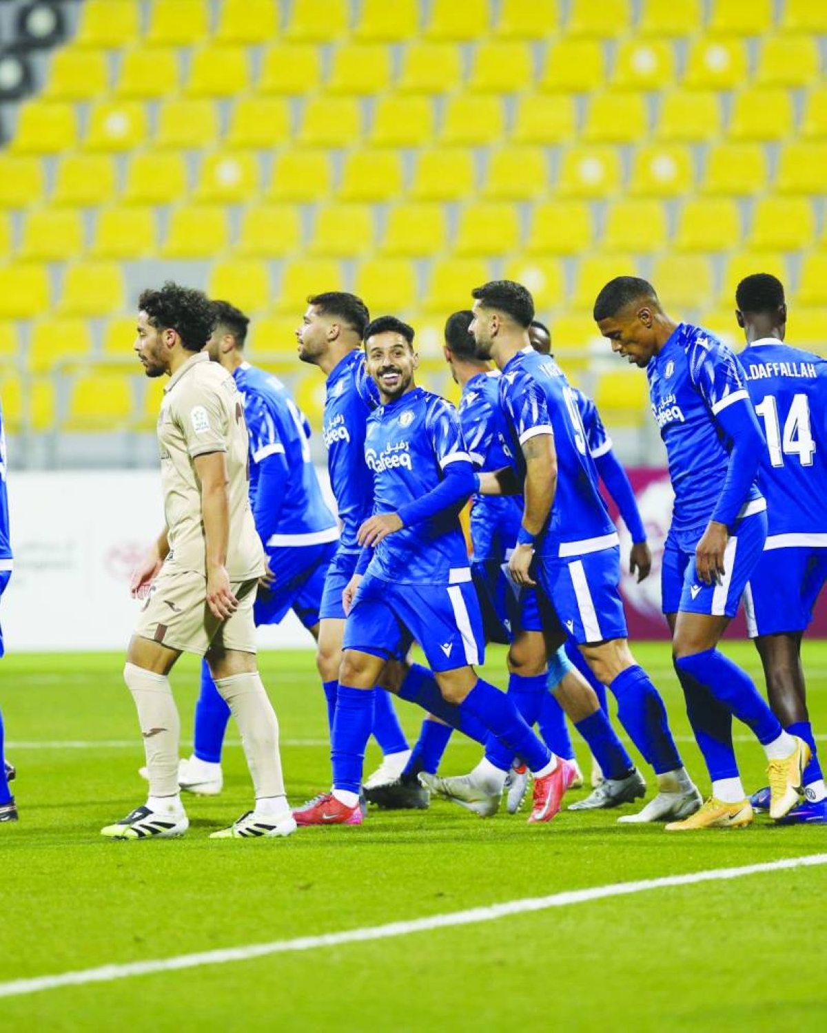 Al Khor's Abdulrahman Mohammed al-Harazi (centre) celebrates after scoring against Al Rayyan.