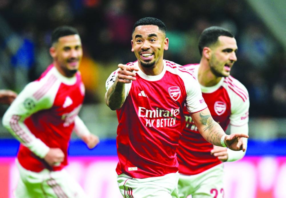 Arsenal’s Gabriel Jesus celebrates with teammates after scoring their second goal against Inter Milan in their Champions League match at the San Siro in Milan. (Reuters)