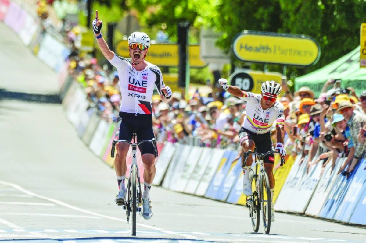 UAE Team Emirates XRG rider Jhonatan Narvaez from Ecuador (right) reacts as his team-mate Australia's Jay Vine wins stage two of the Tour Down Under in Adelaide Thursday. (AFP)