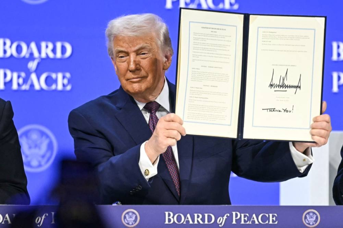 US President Donald Trump holds a signed founding charter at the "Board of Peace" meeting during the World Economic Forum (WEF) annual meeting in Davos on January 22, 2026. US President Donald Trump will show off his new "Board of Peace" at Davos on January 22, 2026, burnishing his claim to be a peacemaker a day after backing off his own threats against Greenland. Originally meant to oversee the rebuilding of Gaza after the war between Hamas and Israel, the board's charter does not limit its role to the Strip and has sparked concerns that Trump wants it to rival the United Nations. (AFP)