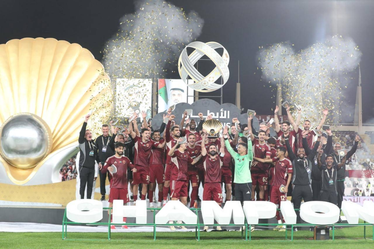 Al Wahda players celebrate after winning the Qatari-Emirati Super Cup clash for the Challenge Shield.