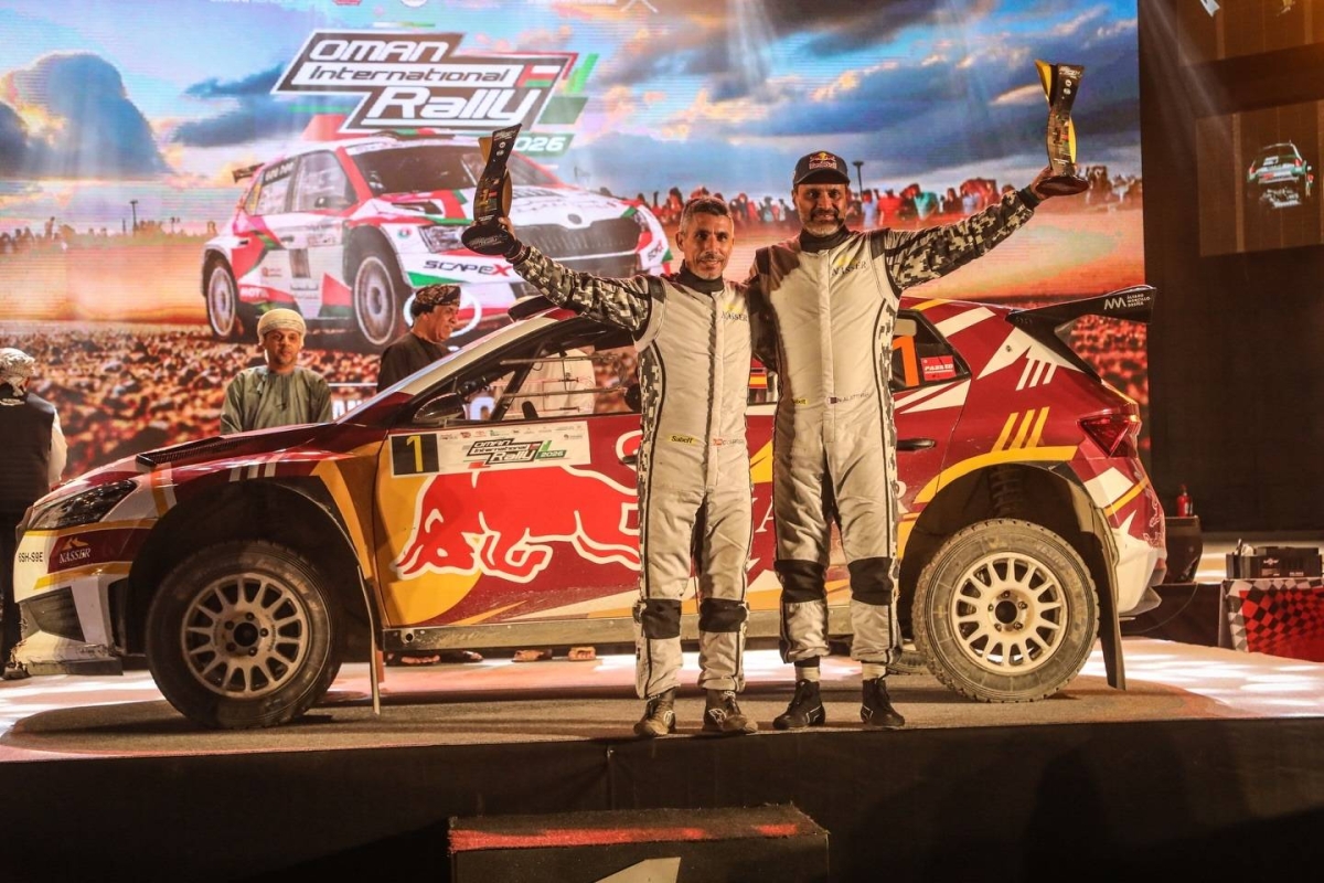 Qatar’s Nasser Saleh al-Attiyah and his Spanish navigator Candido Carrera celebrate after winning the 29th Oman International Rally.