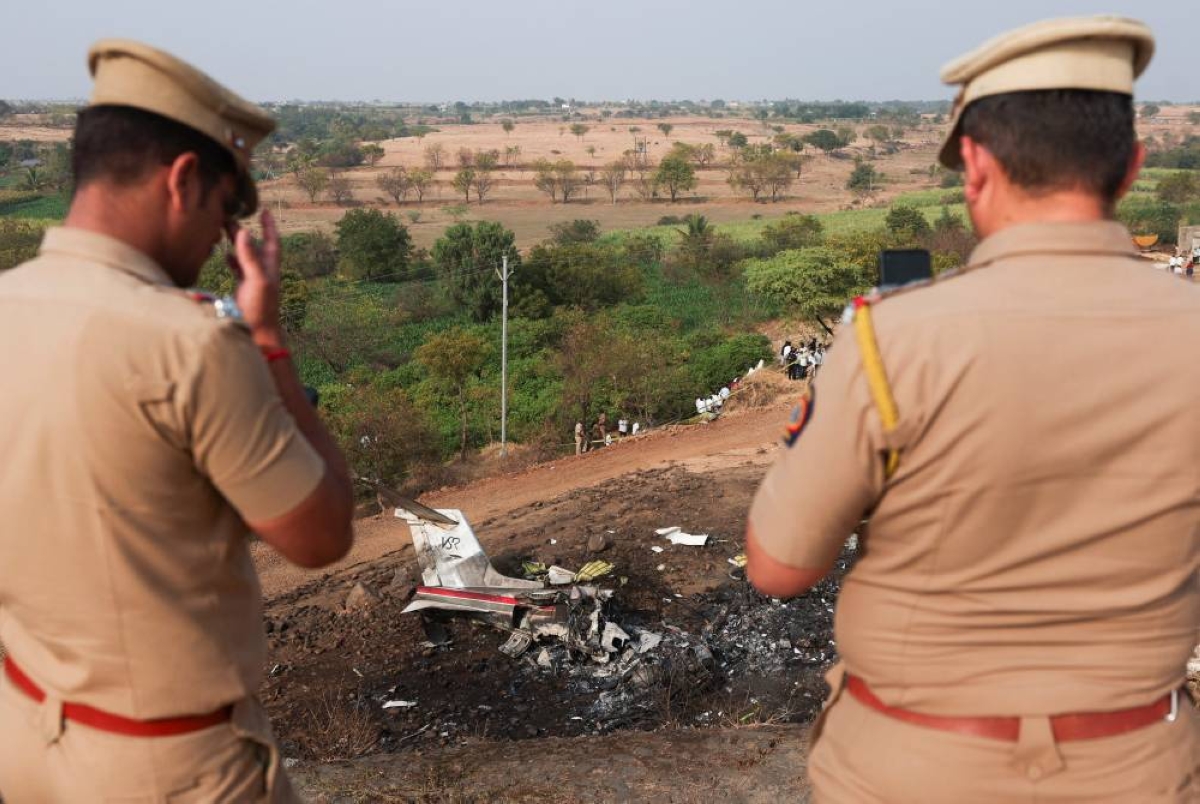 Policemen look at the wreckage of the VSR Ventures-operated Learjet 45 aircraft in which Maharashtra Deputy Chief Minister Ajit Pawar and four others were killed after it crashed in Baramati, India, January 28, 2026. REUTERS