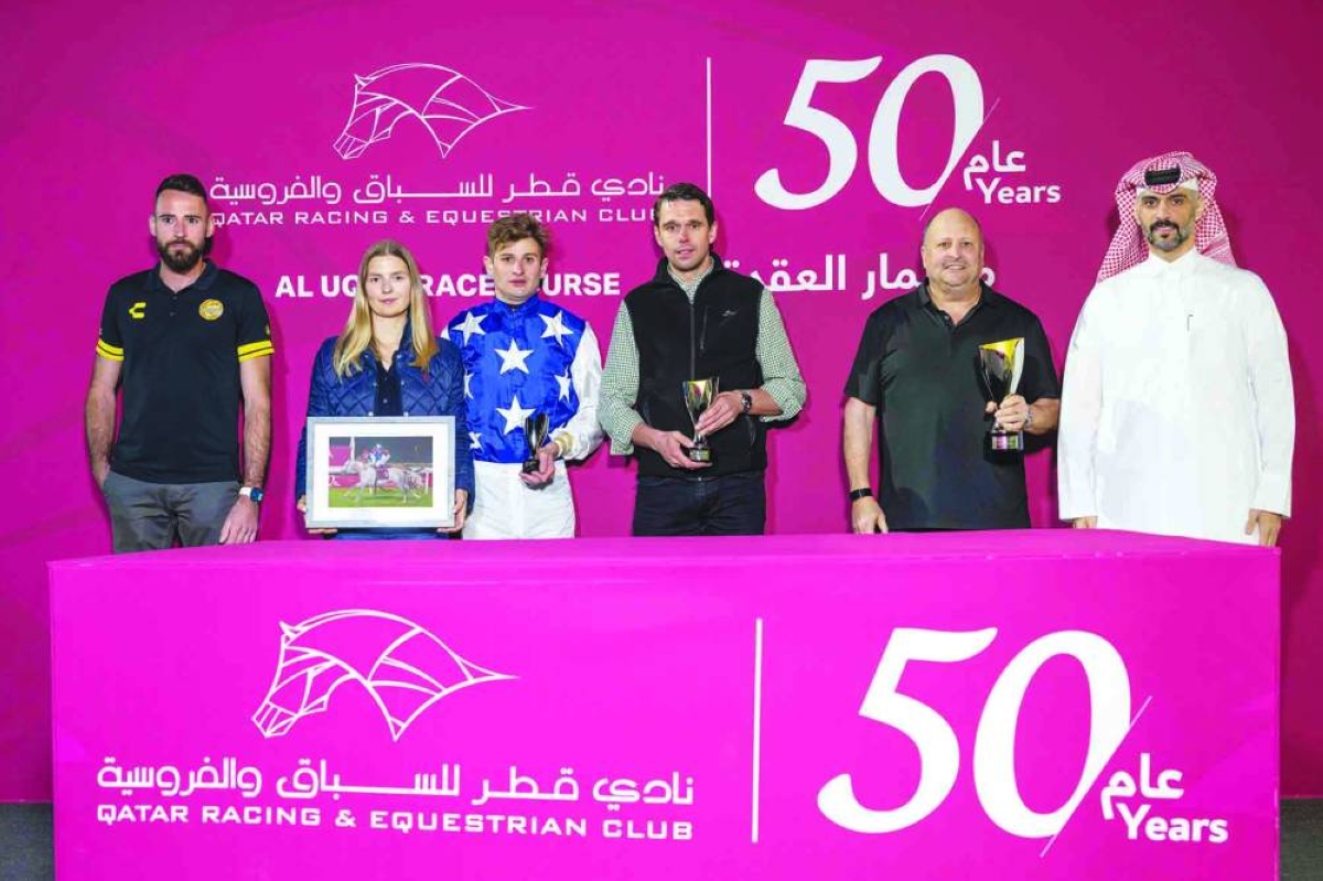 Connections of Caid Du Soleil celebrate after the five-year-old grey horse won the Al Judhay Cup Wednesday.