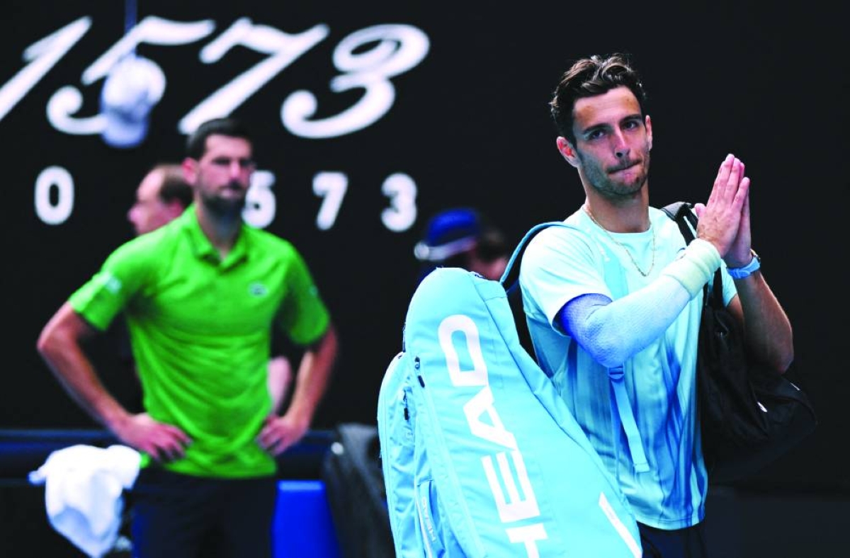 Tennis - Australian Open - Melbourne Park, Melbourne, Australia - January 28, 2026
Italy's Lorenzo Musetti applauds the fans and walks off the court after retiring from his quarter final match against Serbia's Novak Djokovic REUTERS/Jaimi Joy     TPX IMAGES OF THE DAY     