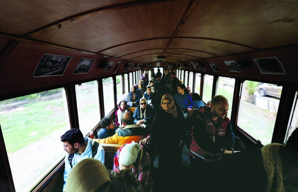 Passengers are seen inside a moving tram in Alexandria. – Reuters