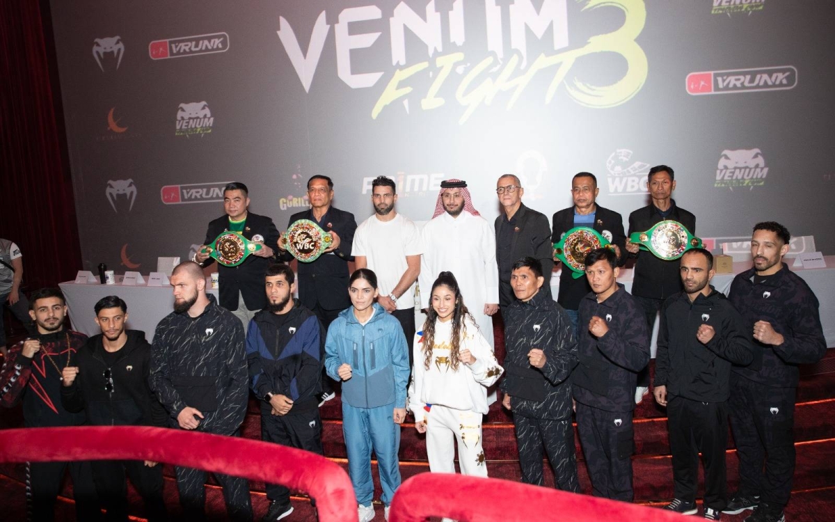 Sheikh Fahad bin Khalid Al Thani, President of the Qatar Boxing Federation (QBF), and Ghanem Saleh al-Kuwari, Head of Boxing at the QBF, pose with international fighters at a press conference on Thursday.