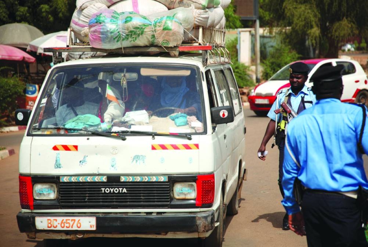 Security forces control traffic in a street, following an attack on the international airport in Niamey, Niger,yesterday.