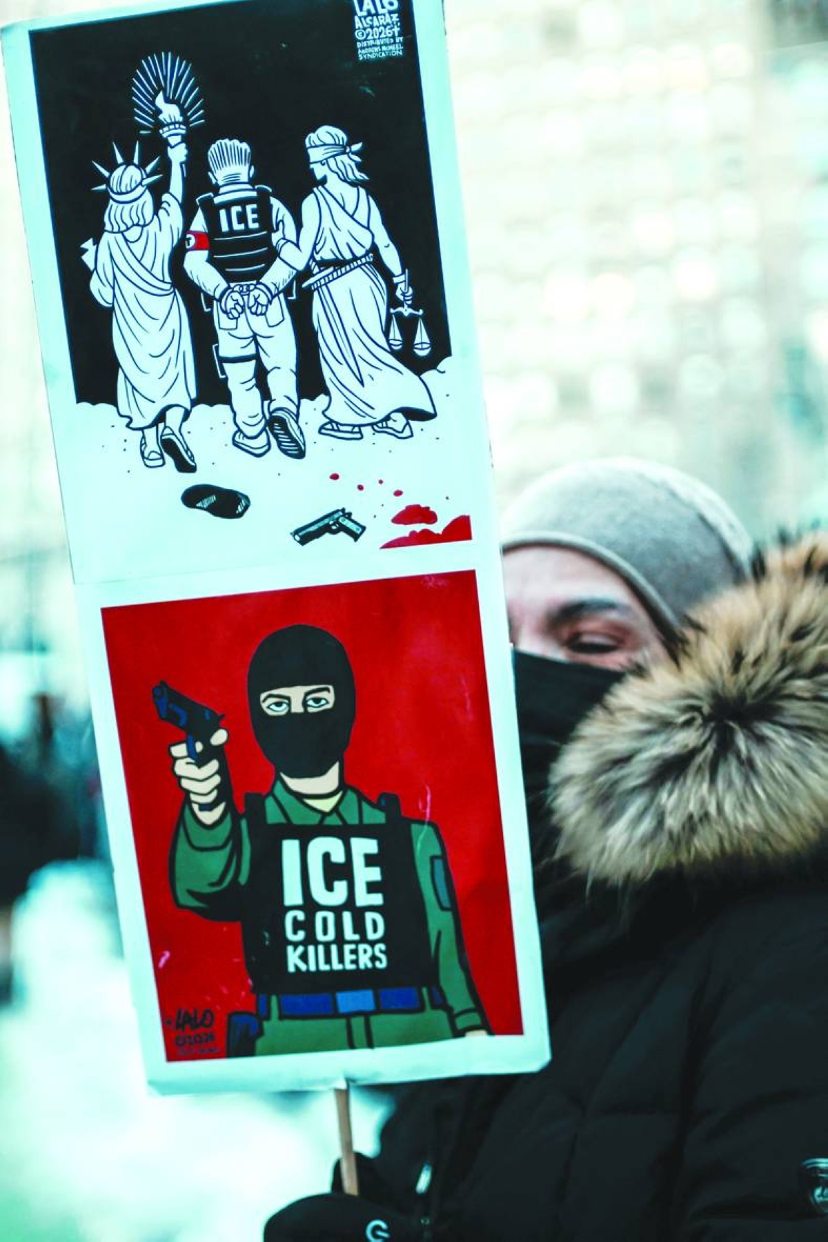 A woman holds a poster during a protest in New York City against the ICE during the ‘National Shutdown’. – Reuters