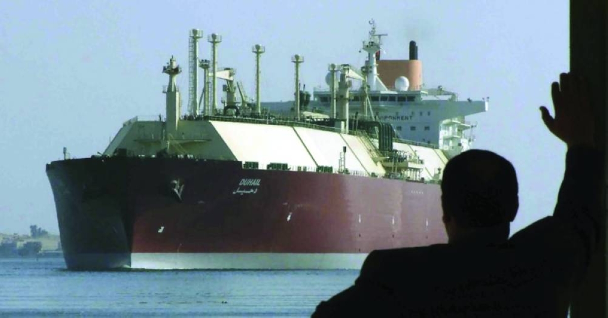 
A man looks at the world’s largest liquefied natural gas tanker DUHAIL as she crosses the Suez Canal on April 1, 2008. The Qatari tanker, built to transport LNG from Qatar to Europe and the US, was on its first trip ever from Qatar to Spain. (Reuters/File Photo) 