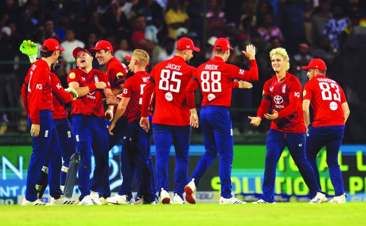 England’s Jacob Bethell celebrates with teammates after taking the wicket of Sri Lanka’s Dasun Shanaka, stumped by England’s Jos Buttler, during the third and final Twenty20 International at Pallekele International Cricket Stadium in Kandy Tuesday. (Reuters)