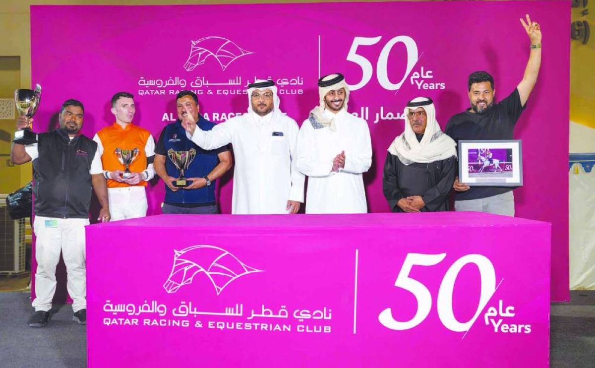 
Connections of Mutamarrid celebrate after the nine-year-old horse won the Ras Rokn Island Cup. 