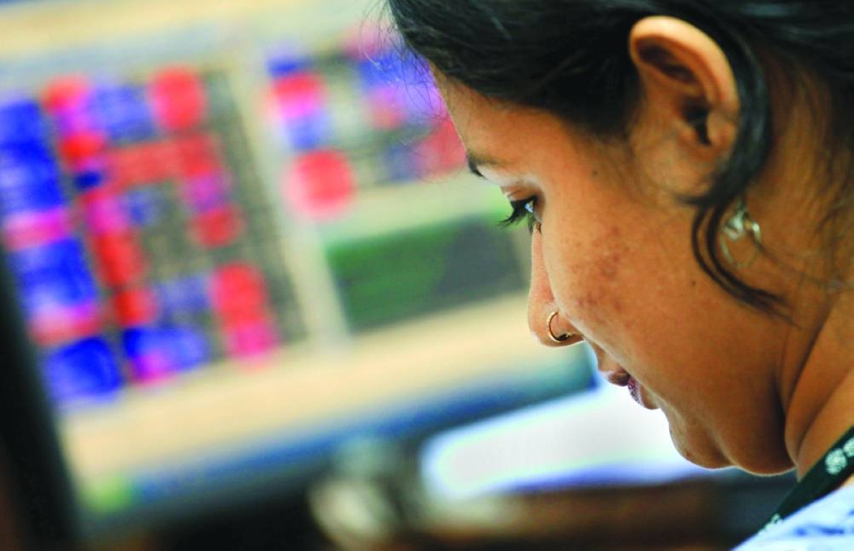 
An Indian share broker looks at her computer screen at the financial market in the Eastern Indian city of Calcutta (file). Although near record peaks, Indian equities are vulnerable to disruption from artificial intelligence and, without any companies in the sector, have been left behind in the rush to AI. 