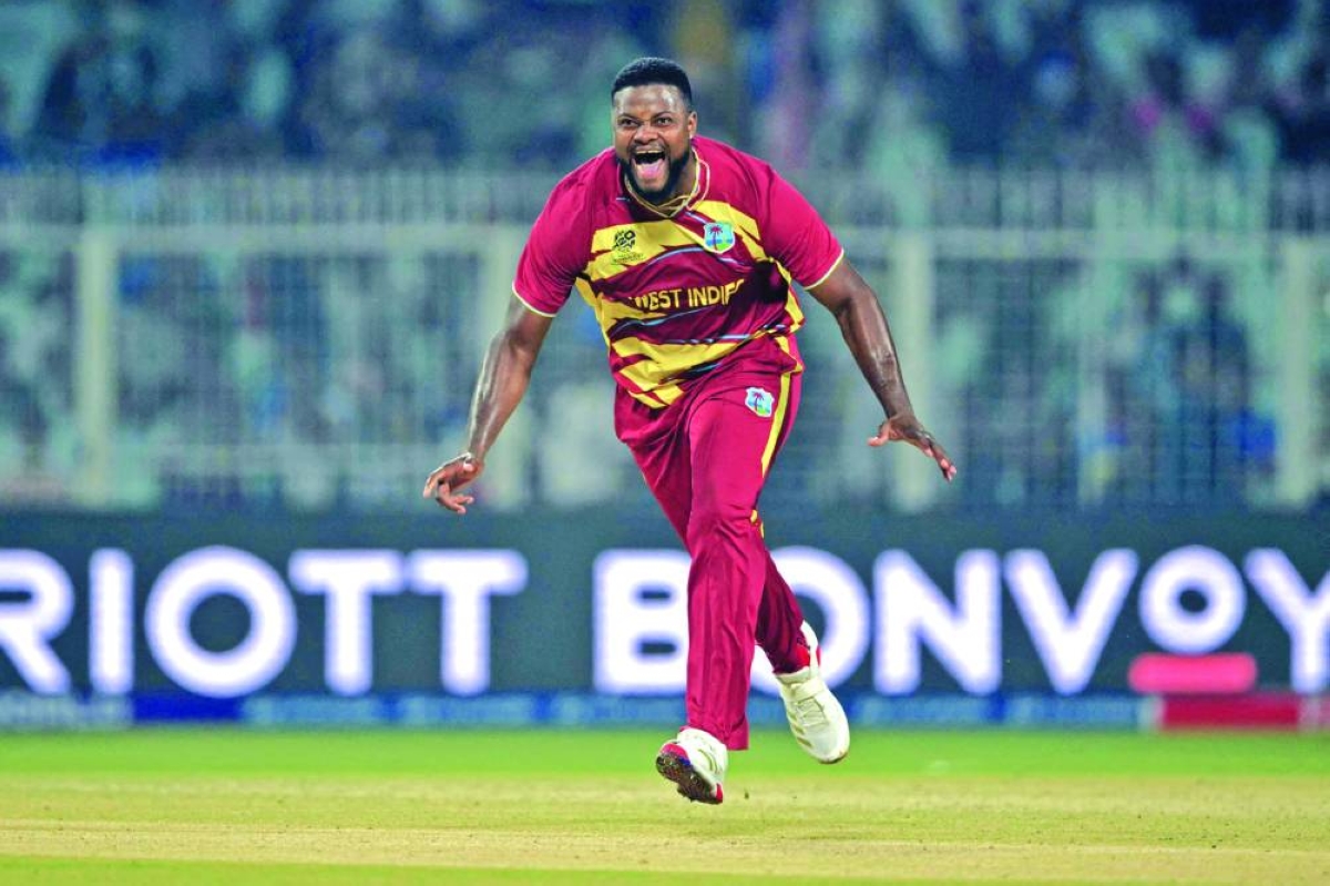 West Indies' Romario Shepherd celebrates after taking the hat trick wicket during the 2026 ICC Men's T20 Cricket World Cup group stage match between Scotland and West Indies at the Eden Gardens in Kolkata on February 7, 2026. (AFP)