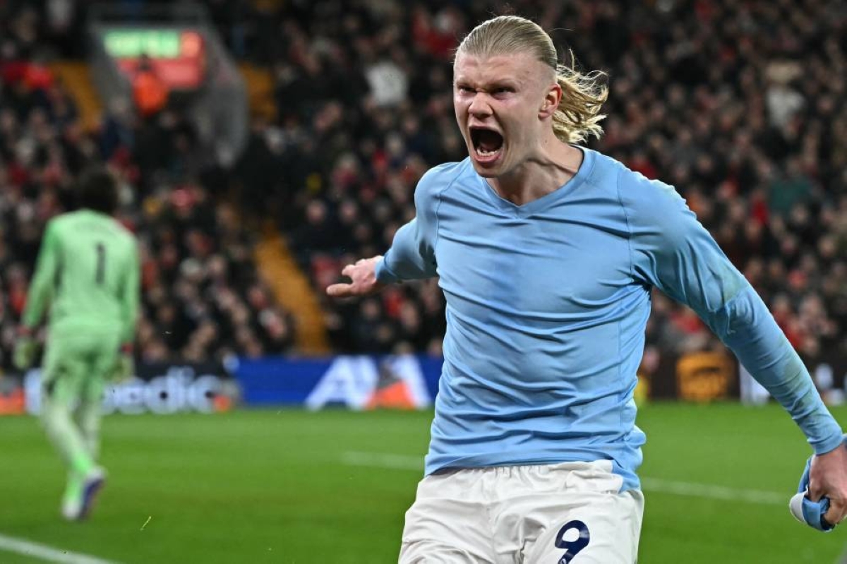 Manchester City’s Norwegian striker Erling Haaland celebrates after scoring his team’s second goal during the English Premier League match against Liverpool at Anfield in Liverpool Sunday. (AFP)