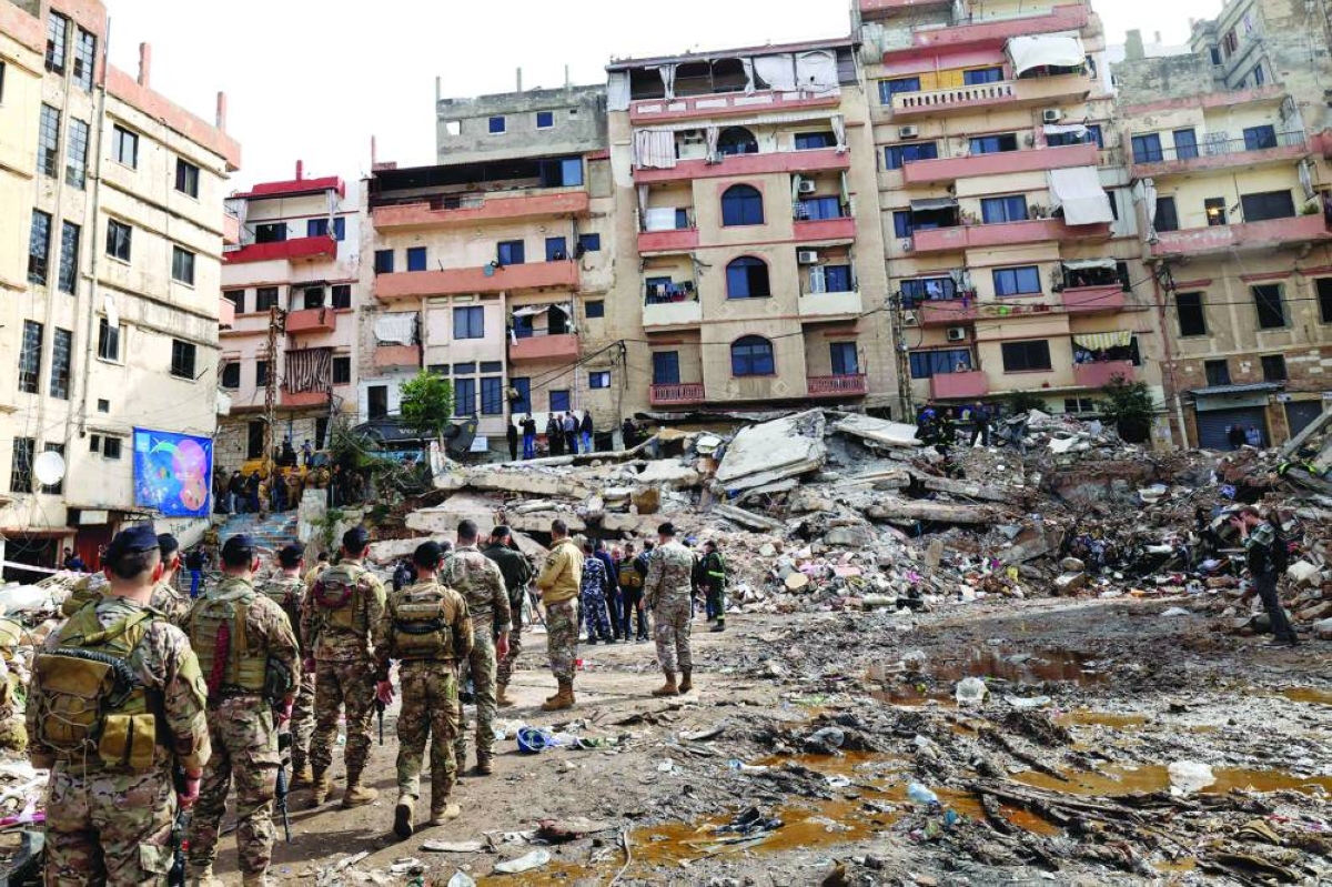 Lebanese soldiers secure the site on February 9, 2026, where an old residential building collapsed in the Bab al-Tabbaneh neighborhood of Tripoli a day earlier. The death toll in a building collapse in the northern Lebanese city of Tripoli rose to 14 after search and rescue operations ended, the civil defence chief said on February 9. (AFP)