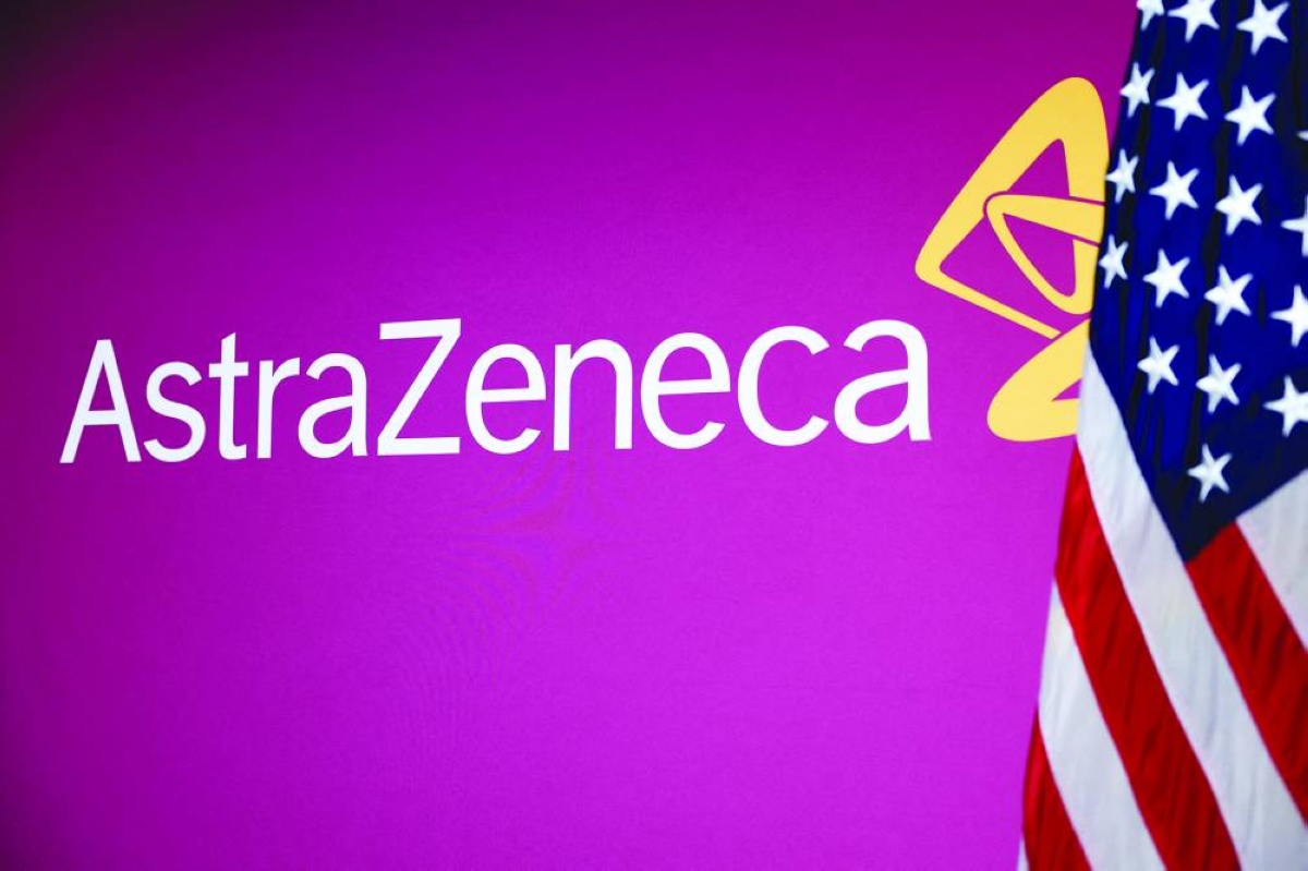 FILE PICTURE: A U.S. flag stands next to the AstraZeneca logo in Washington, D.C.