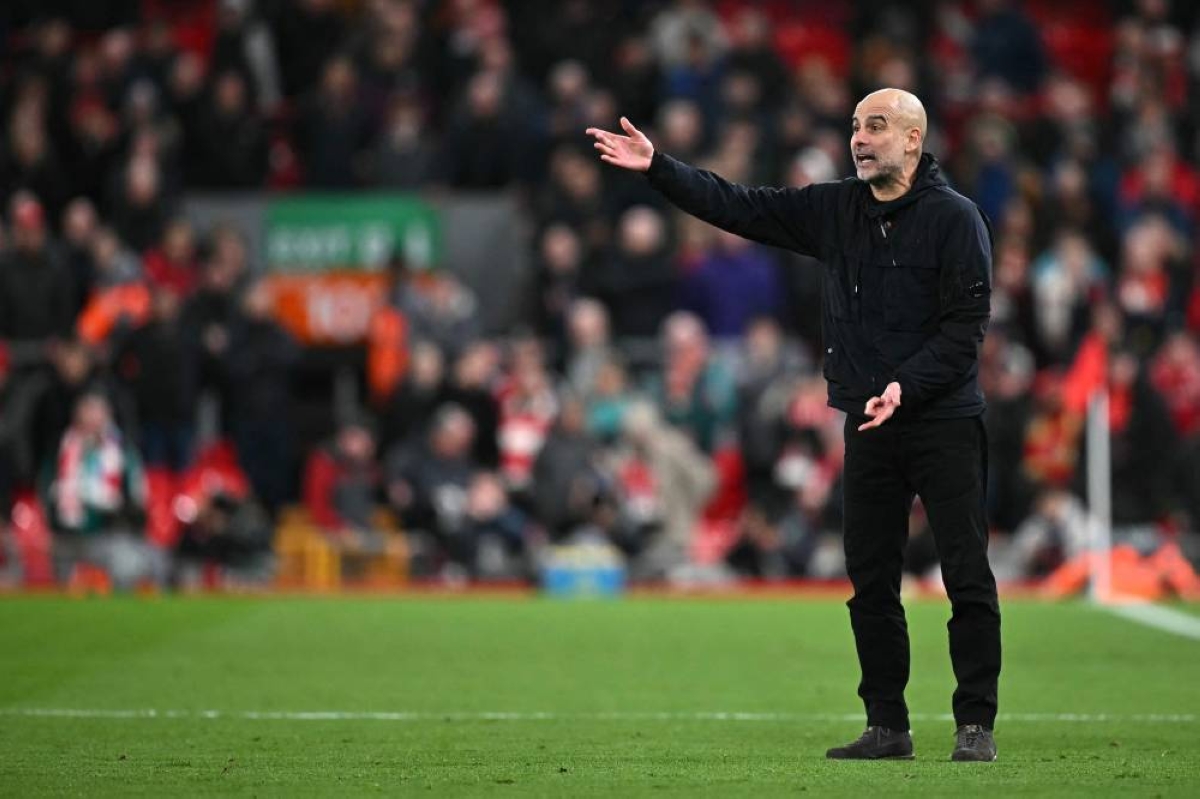 Manchester City's Spanish manager Pep Guardiola reacts during the English Premier League football match between Liverpool and Manchester City at Anfield in Liverpool, north west England on February 8, 2026. (AFP)