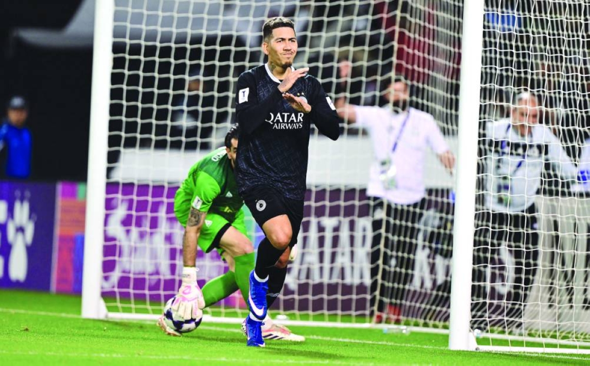 Al Sadd's Roberto Firmino celebrates after scoring against Tractor FC at the Jassim Bin Hamad Stadium in Doha Tuesday.