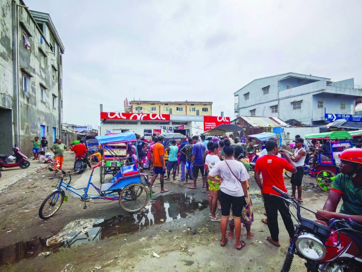 Residents gather in the city of Toamasina, on the east coast of Madagascar, struck by Tropical Cyclone Gezani on February 11, 2026. (Photo by Tsiky Sikonina / AFP)