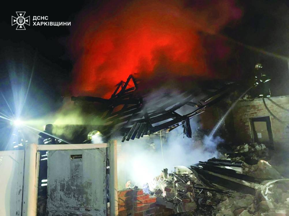 Firefighters work at the site of a house hit by a Russian drone strike, in the town of  Bogodukhiv in Kharkiv region, Ukraine in this handout picture released Wednesday.
